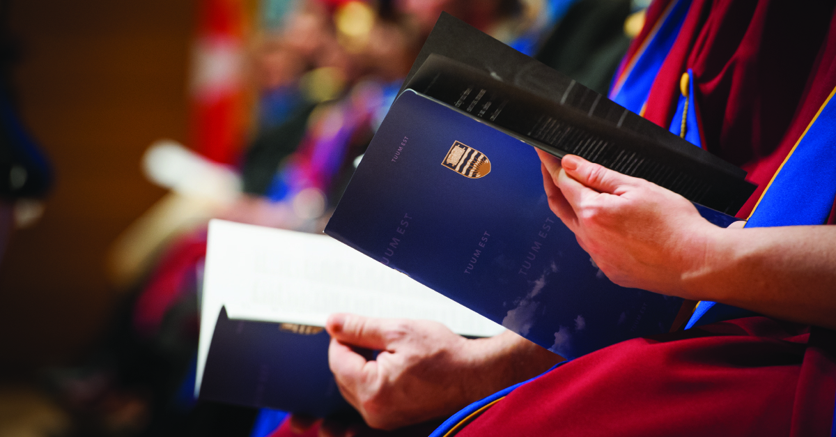 hands holding a diploma