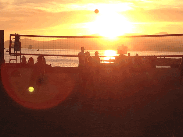 People playing beach volleyball