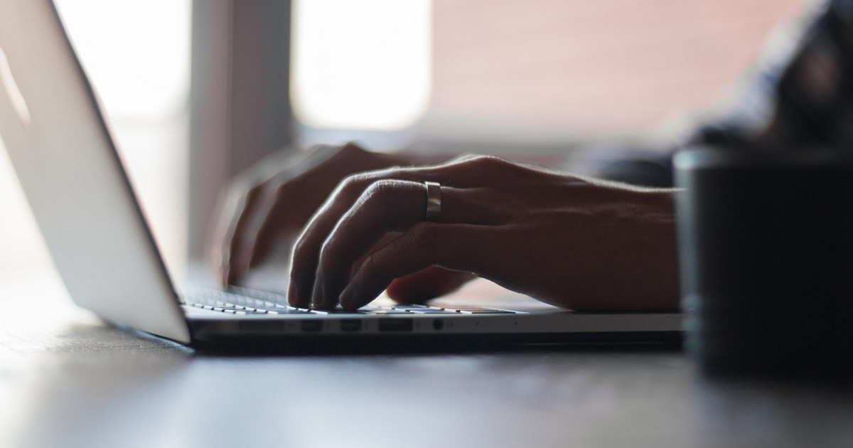 A man typing on a computer