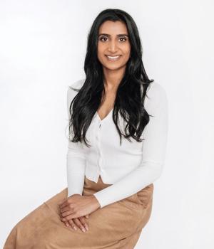 Person sitting in a chair looking at camera