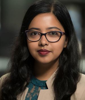 person with glasses looking at camera