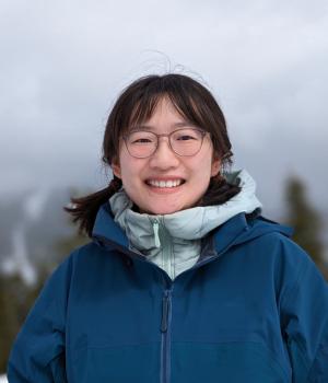 person standing in a winter jacket outside 