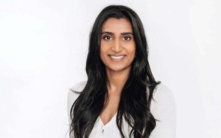 Person sitting in a chair looking at camera