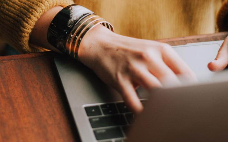 Image of hands typing on a keyboard