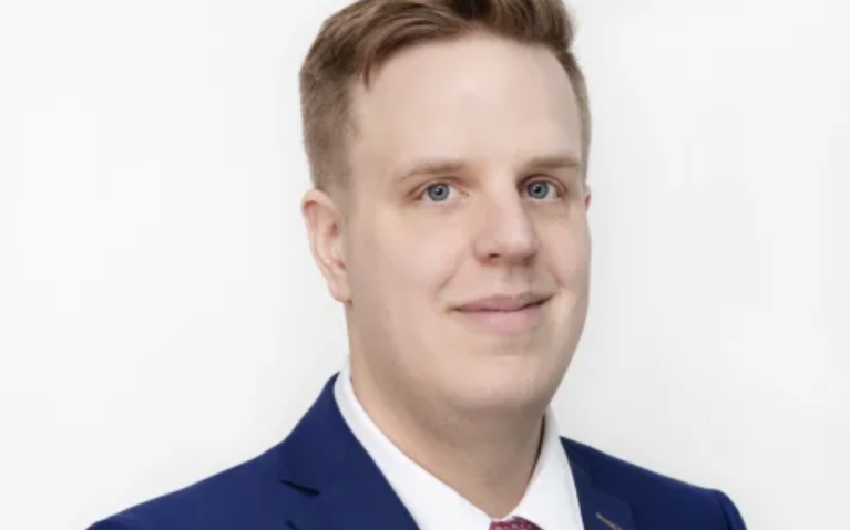 white man wearing a suit with a white background