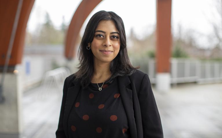 Women wearing black blazer and shirt with red dots