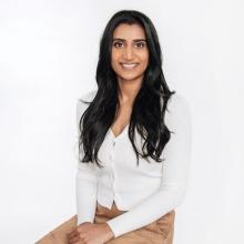 Person sitting in a chair looking at camera