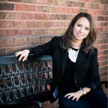 Kylynda Bauer sitting on a bench