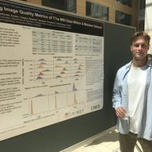 Man standing in front of research poster 