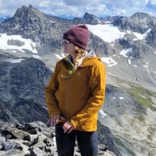 Alysha standing with mountains in the back