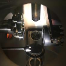 In addition to running experiments on quantum materials, we also need to synthesize our samples! Here is the interior of a pulse laser deposition (PLD) machine, which makes thin films. These films form when high powered laser pulses ablate material from the "target", a puck of raw materials that is help in this system in the top carousel.