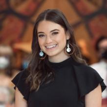 Woman wearing black shirt with earrings